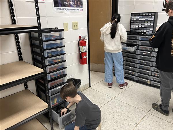 Students finding parts for their robot.